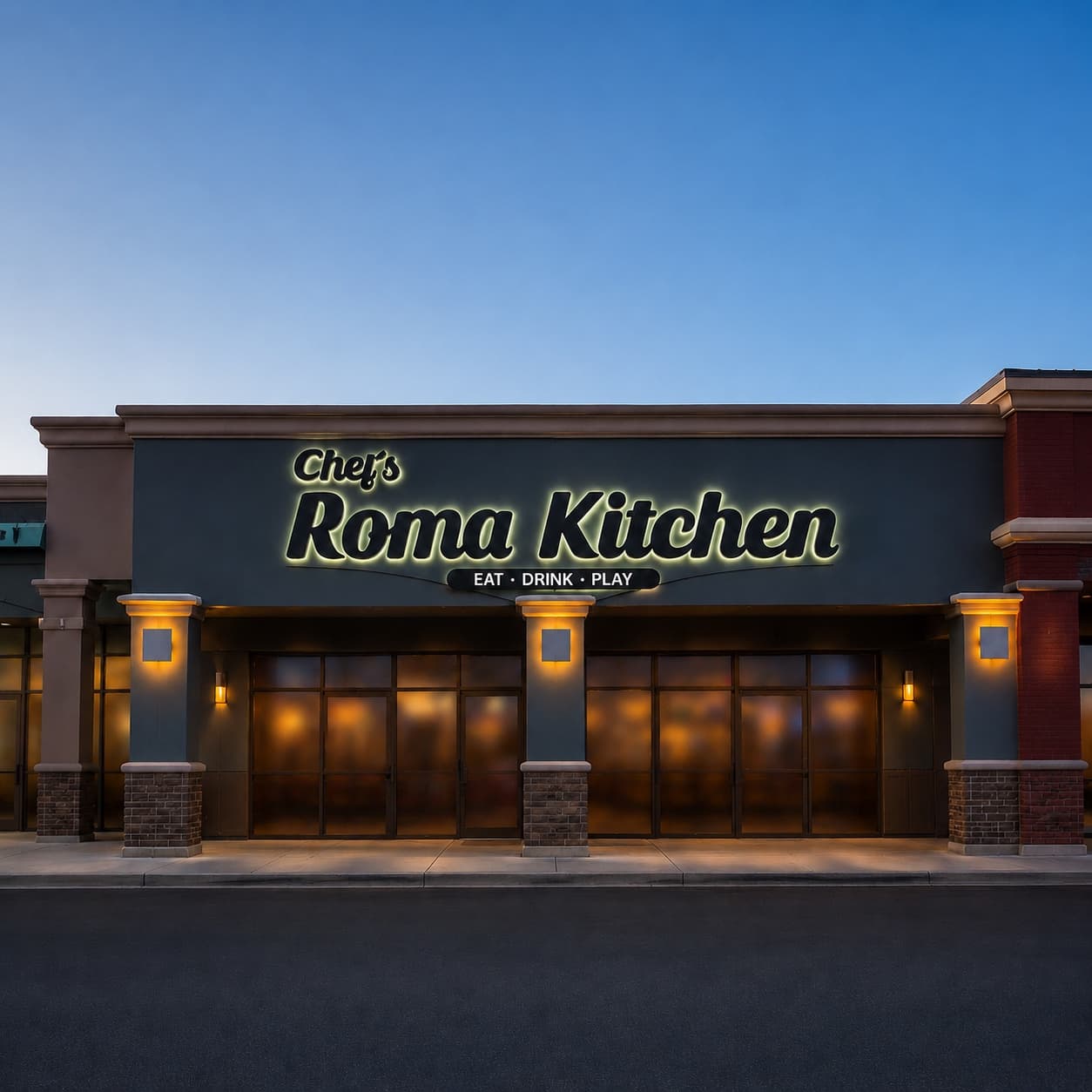 Chef's Roma Kitchen exterior at dusk on Horizon Ridge Parkway in Henderson, with the warm glowing script signage