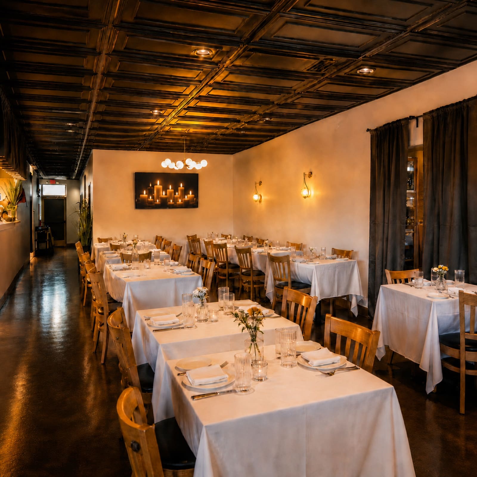 Chef's Roma Kitchen dining room set with white tablecloths for a private event