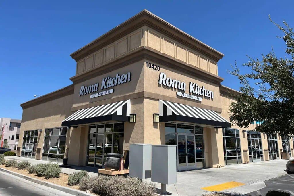 Roma Kitchen exterior on S Decatur Boulevard in Southern Highlands, Las Vegas, with white striped awnings